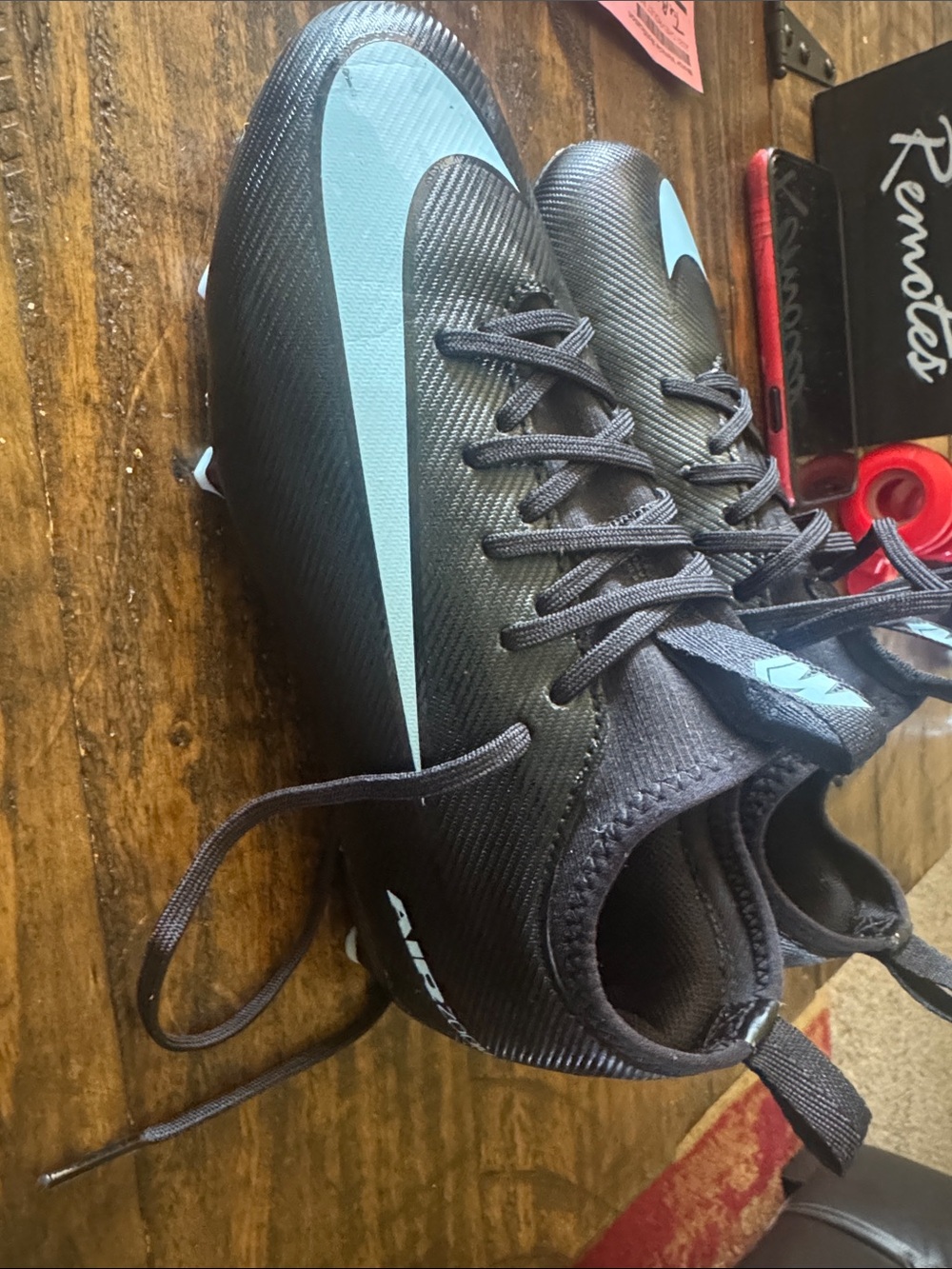 Nike Black Cleats with Light Blue Swoosh